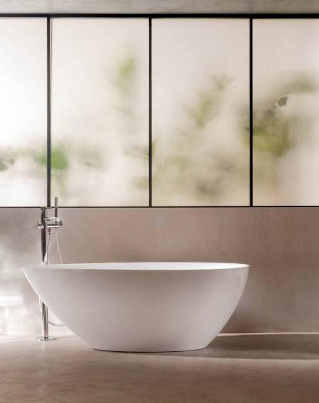 In the realm of bathroom design, elegant curves and graceful arches can elevate the bathroom from a mere functional space to a true sanctuary of serenity and luxury. The gentle contours of the bathtub, arching faucets or the soft lineation of a mirror invite you to step into a world of beauty and relaxation.   (Pictured: Kauai Stonex® oval bathtub)
